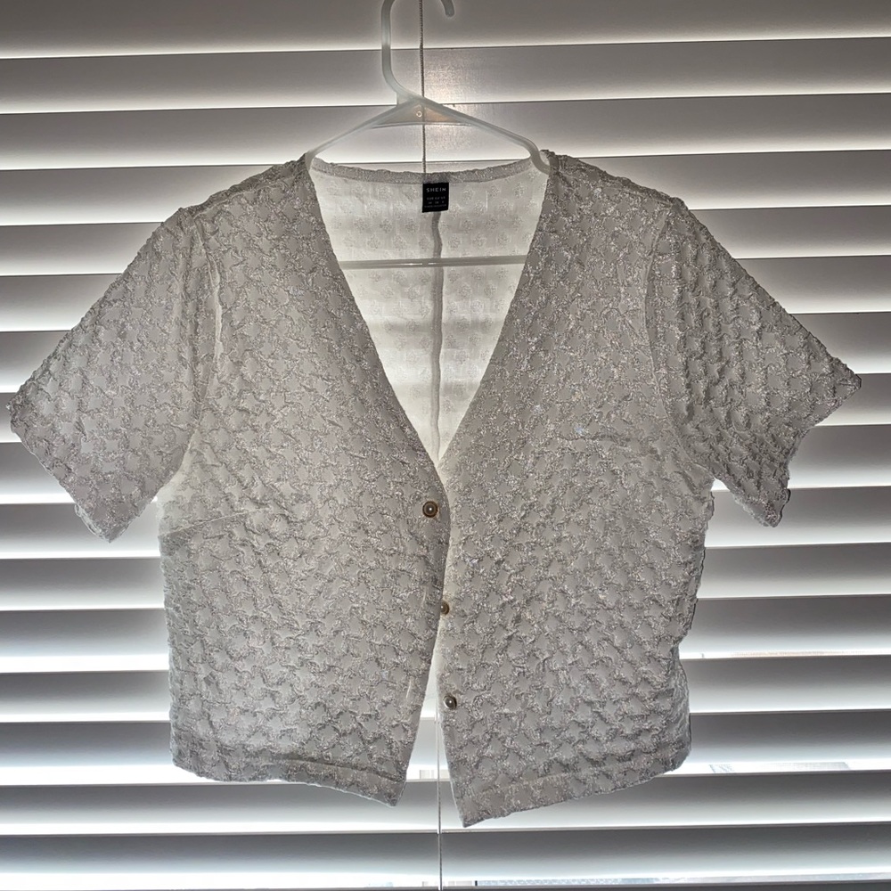 White velvet kinda shirt, inside is soft